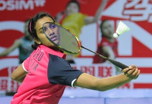 P.V. Sindhu of India hits a return to Eriko Hirose of Japan during their women's singles first round match at the China Open badminton tournament in Shanghai on November 14, 2012.  AFP PHOTO/Peter PARKS